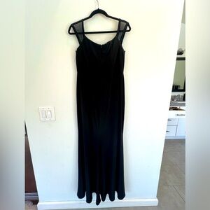 Black form fitting dress with a slight bottom flare